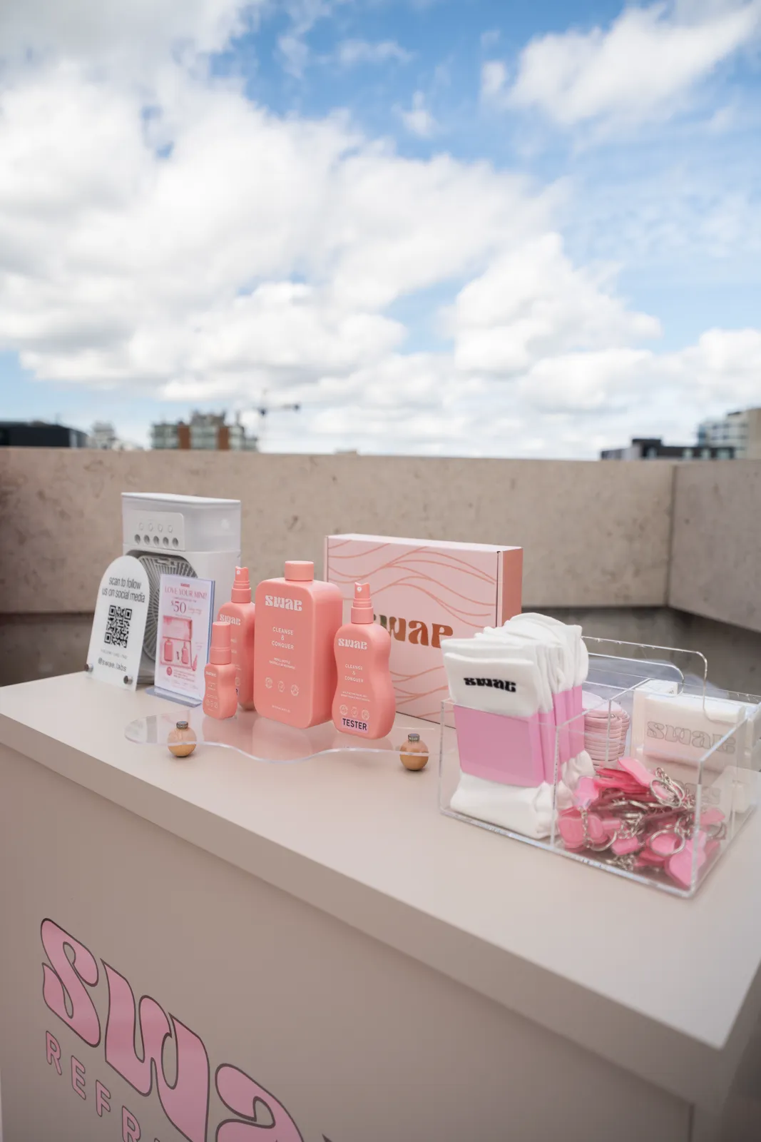 The product table from the end, with the branded counter front in shot.